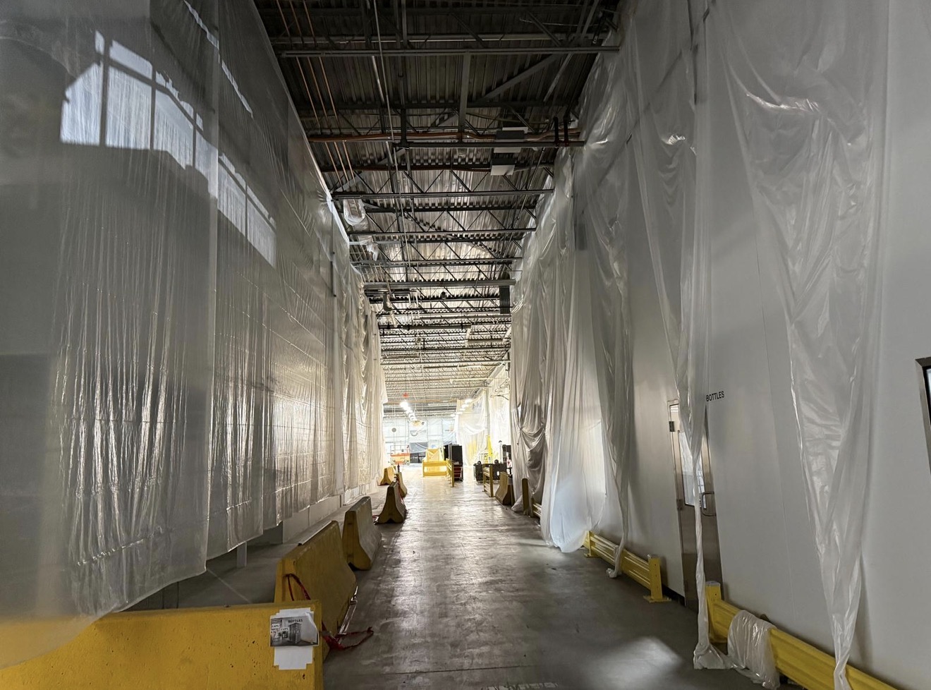 Industrial warehouse prepared for cleaning and protective coating